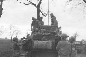 Tanks of the 4th Armoured Division bring back casualties