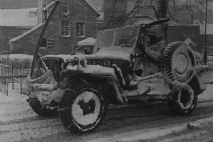 30th Division jeep moving through the streets of Malmedy