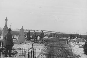 Members of 101st Airborne Division bury their dead