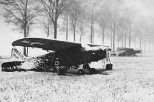An artillery observation plane under camouflage netting
