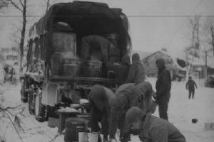 Chow is served to soldiers amid the snow